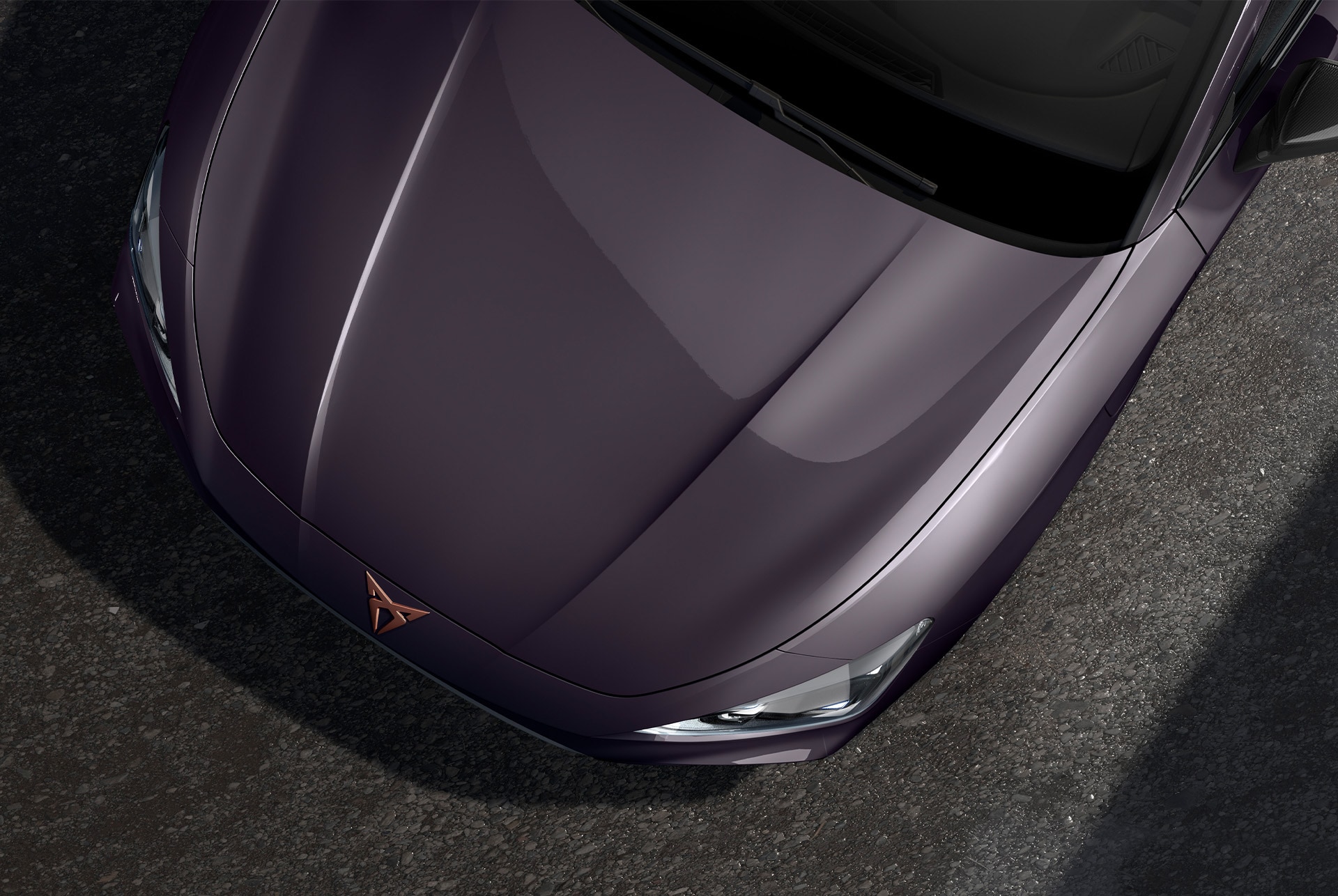 bird’s eye view of a midnight black new cupra leon 2024 car hood