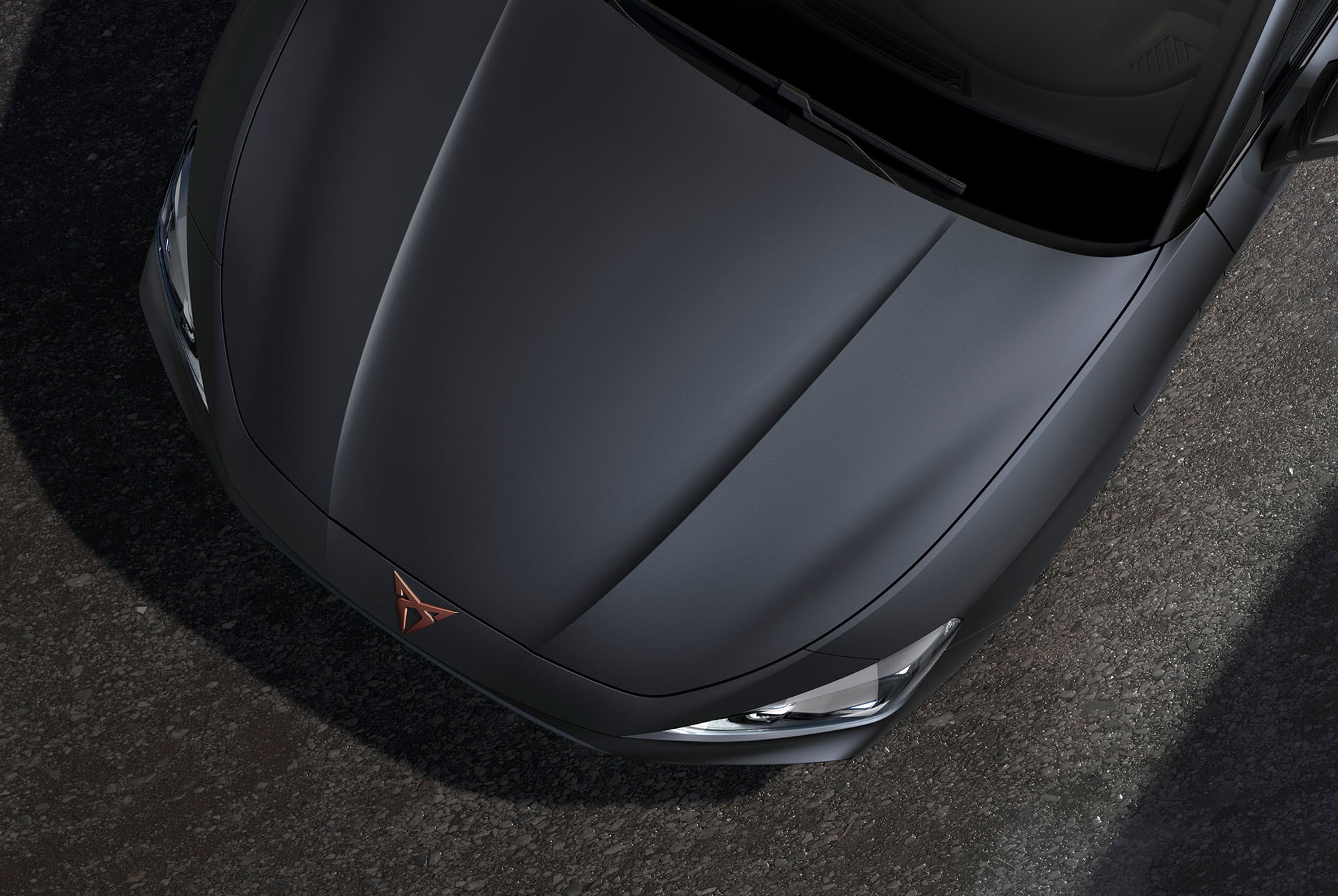 bird’s eye view of a midnight black new cupra leon 2024 car hood